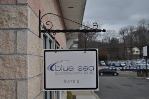 Guerneville Wayfinding Signs outdoor hanging blade sign blue sea building business wayfinding address sign 300x199
